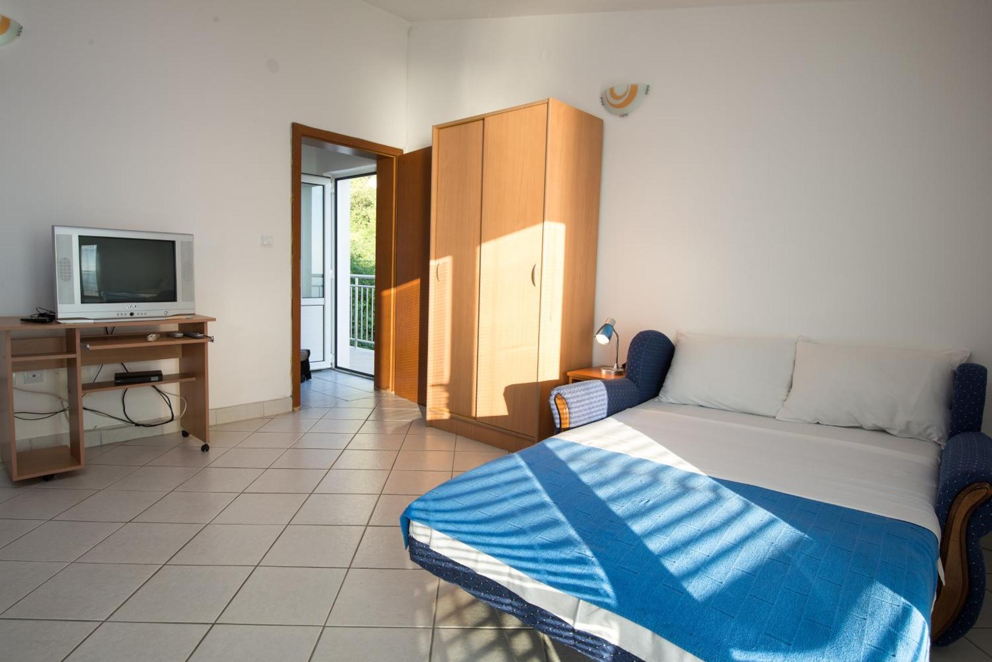 Apartments Dragisic Ilha Ilha Sveti Stefan Quarto foto
